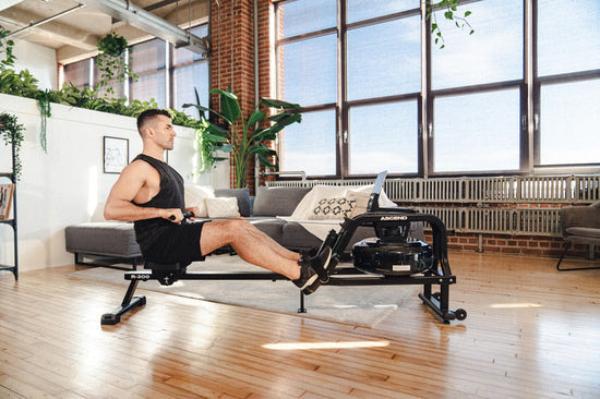 man on rowing machine showing correct rowing posture