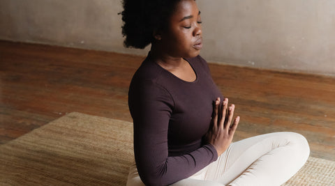 woman meditating at home