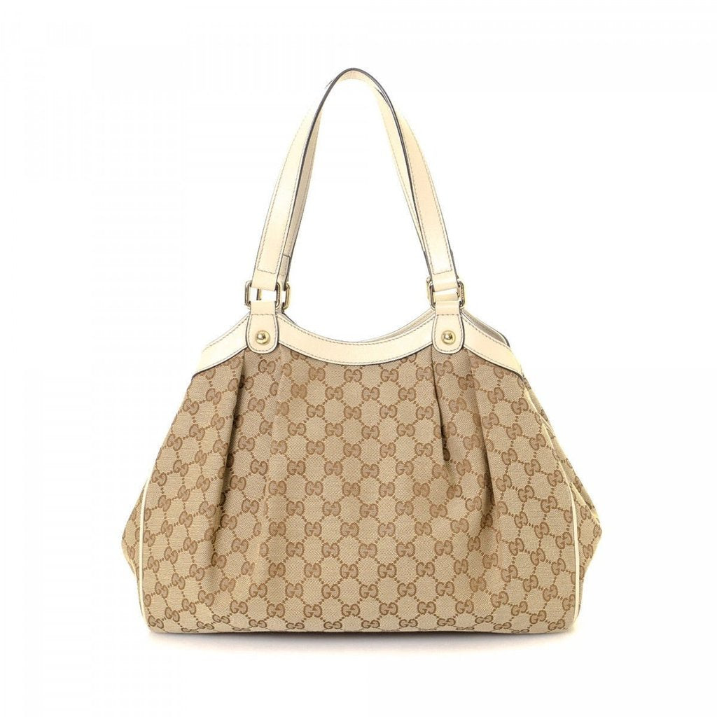 beige gucci purse