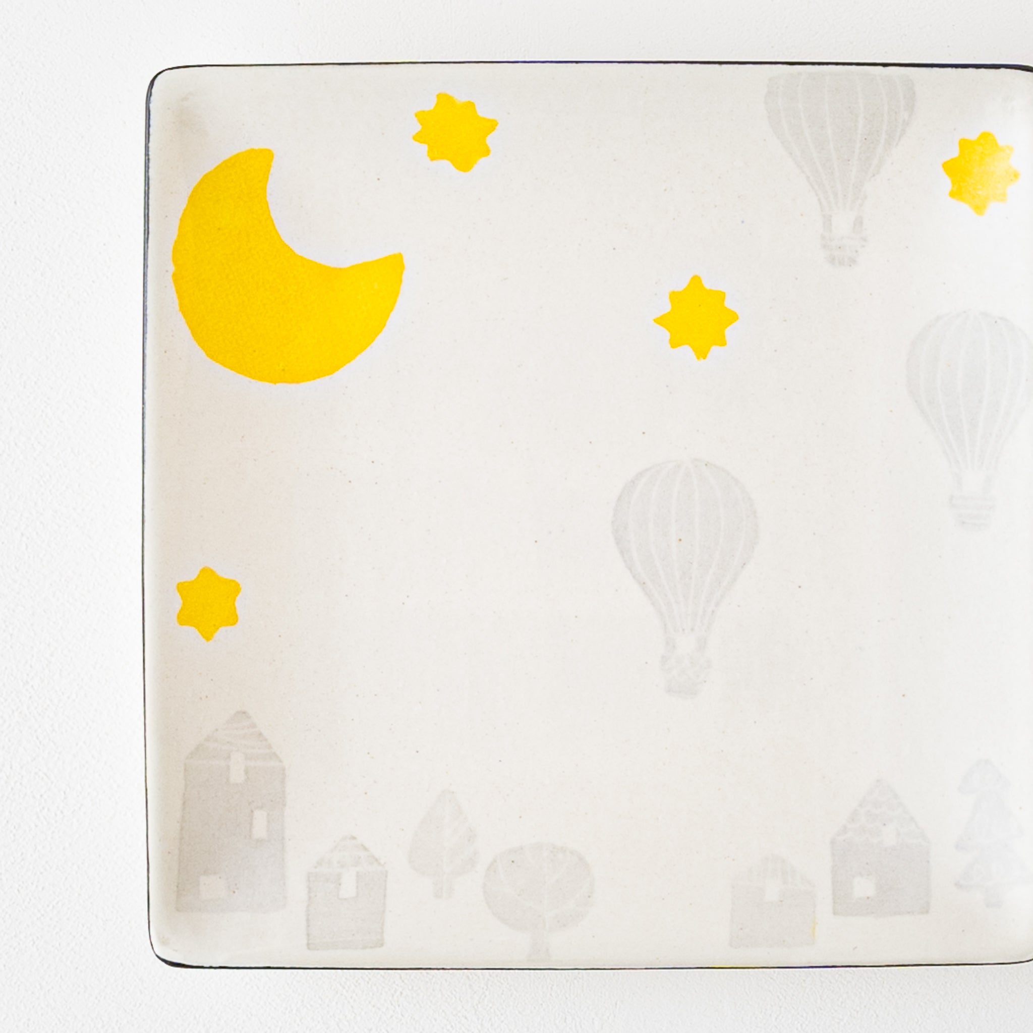 A square plate from Yasumi Koubou with cute Japanese paper dyeing of the moon and balloons