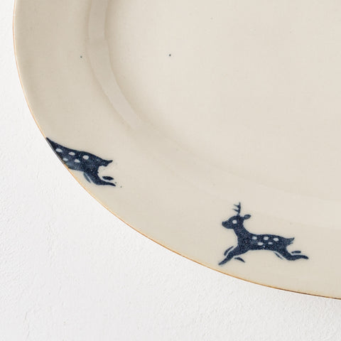 Naoko Yoshimura's scraped oval plate with a deer pattern