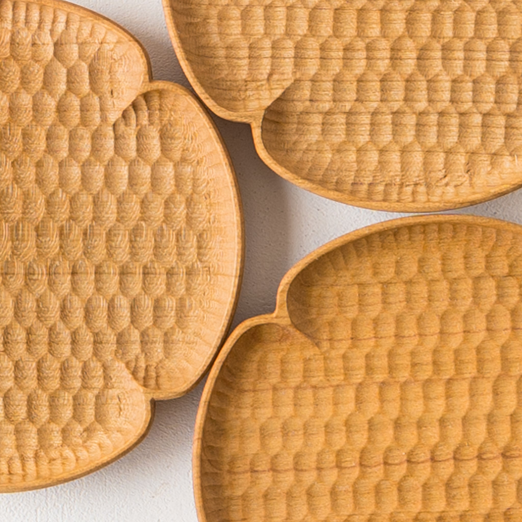 Kazunori Gentakatsuka's flower-shaped coaster with delicately carved bee patterns