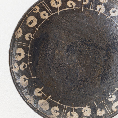 Nobufumi Watanabe's waxless black glaze 7-inch plate that brightens up the dining table