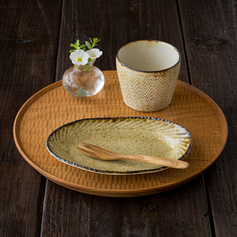 A free cup with a whale herringbone design by Haru Tsukizoe that will add color to your dining table.