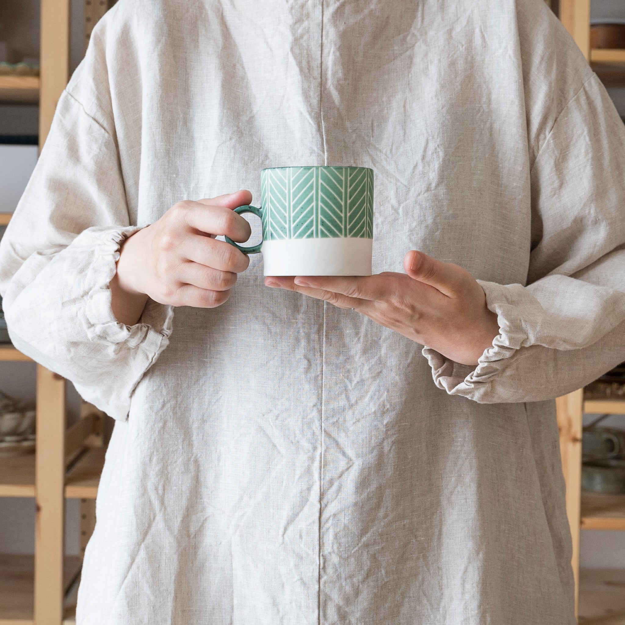 Yukari Nakagawa's mug with a stylish herringbone pattern and green