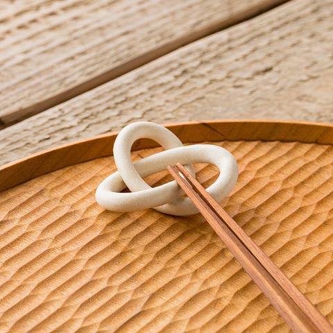 Mr. Tsujimoto's pretzel chopstick rests make you want to collect them.