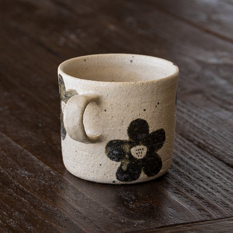 Asako Okamura's flower-patterned mug is perfect for desk work.