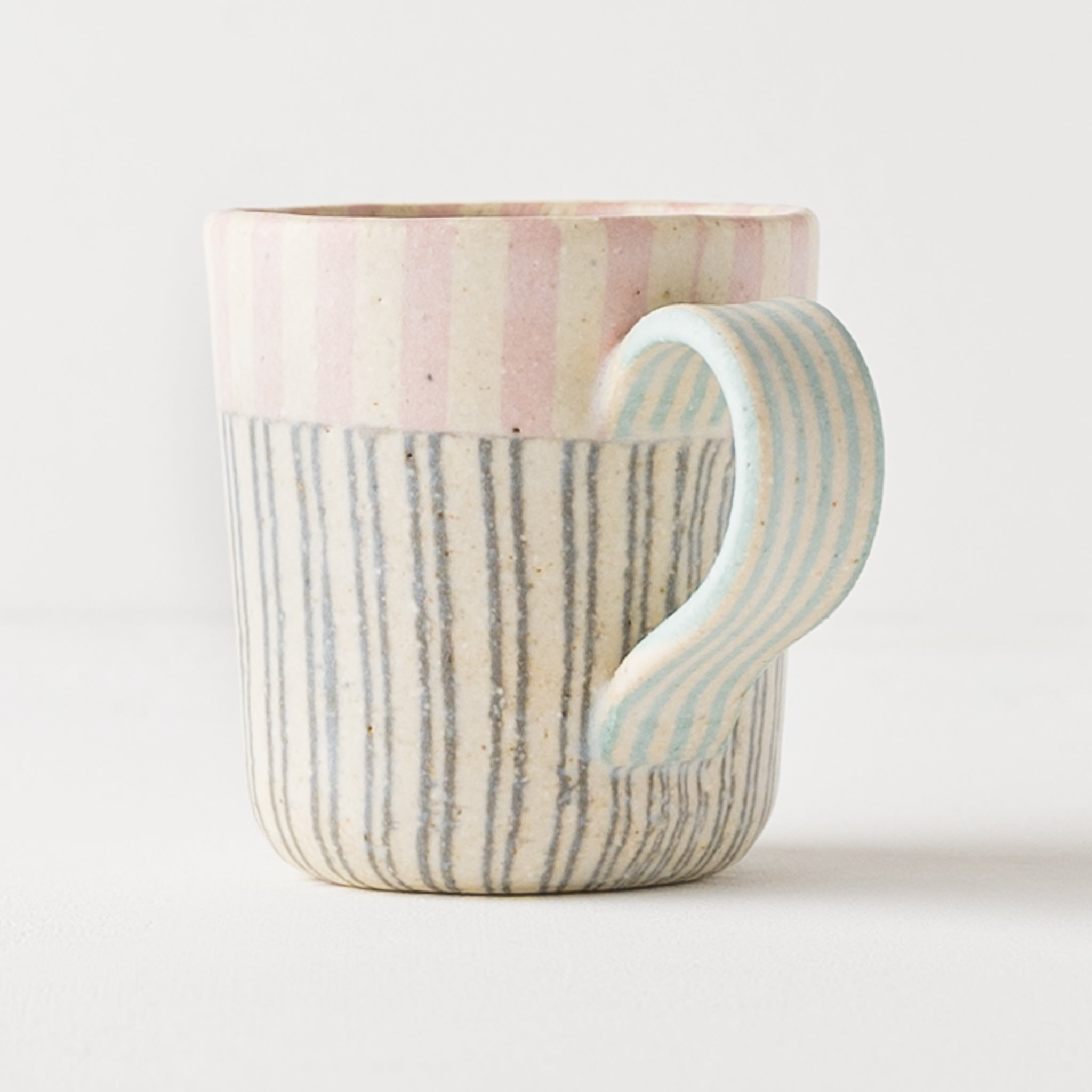 Mug made by Hanako Sakashita with cute gentle pink and light blue.