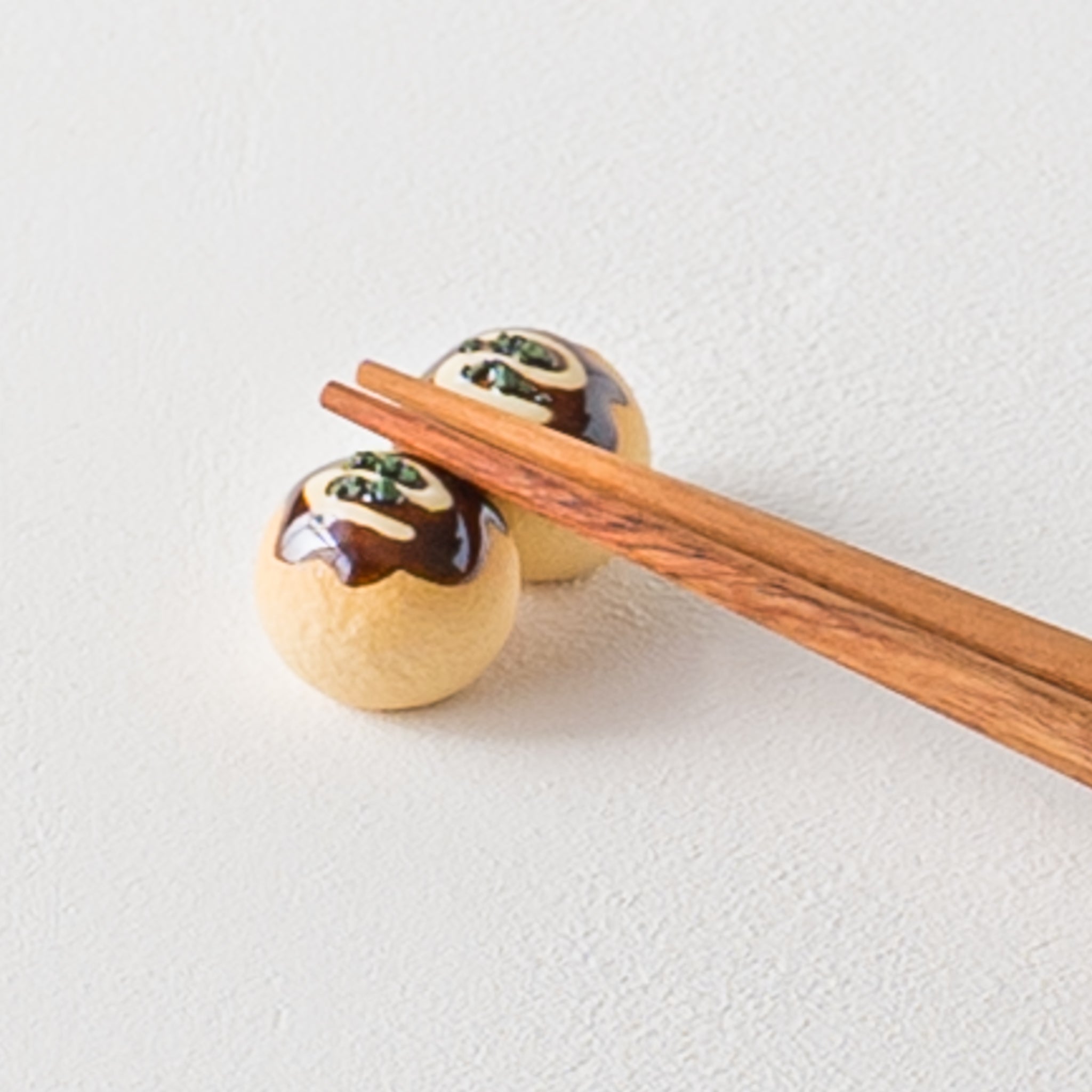 Ihoshiro kiln's cute takoyaki chopstick rest that even has a toothpick