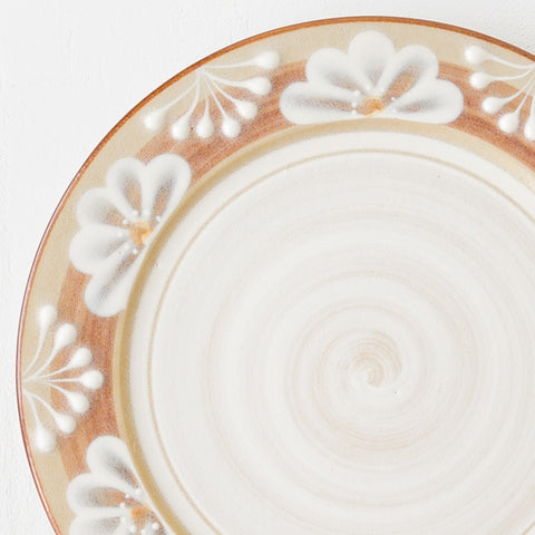 A fine stoneware plate by Adachi No Potari with a lovely retro-modern floral pattern.