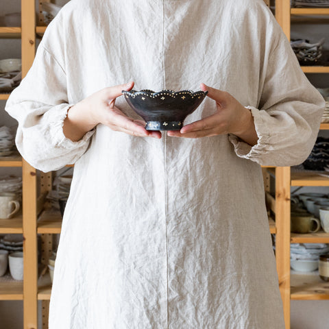 Aiko Takasu's Rinka Takadai Bowl is soothing with its warm black color and cute patterns.