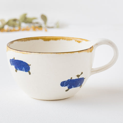 A Japanese paper-dyed mug from Yasumi Kobo that will make you feel warm and relaxed with an adorable hippopotamus.