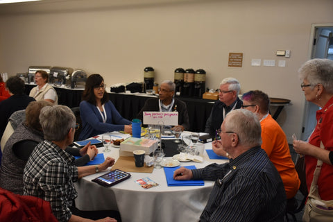 group of people working around a table