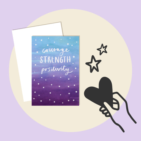 Rectangular card with a blue and purple ombre design and white stars, text in handwriting styled font reads "Courage, Strength, Positivty". Background is lilac with a cream circle behind the card, and a black outline illustration of a hand holding a heart, with 2 stars above it. 