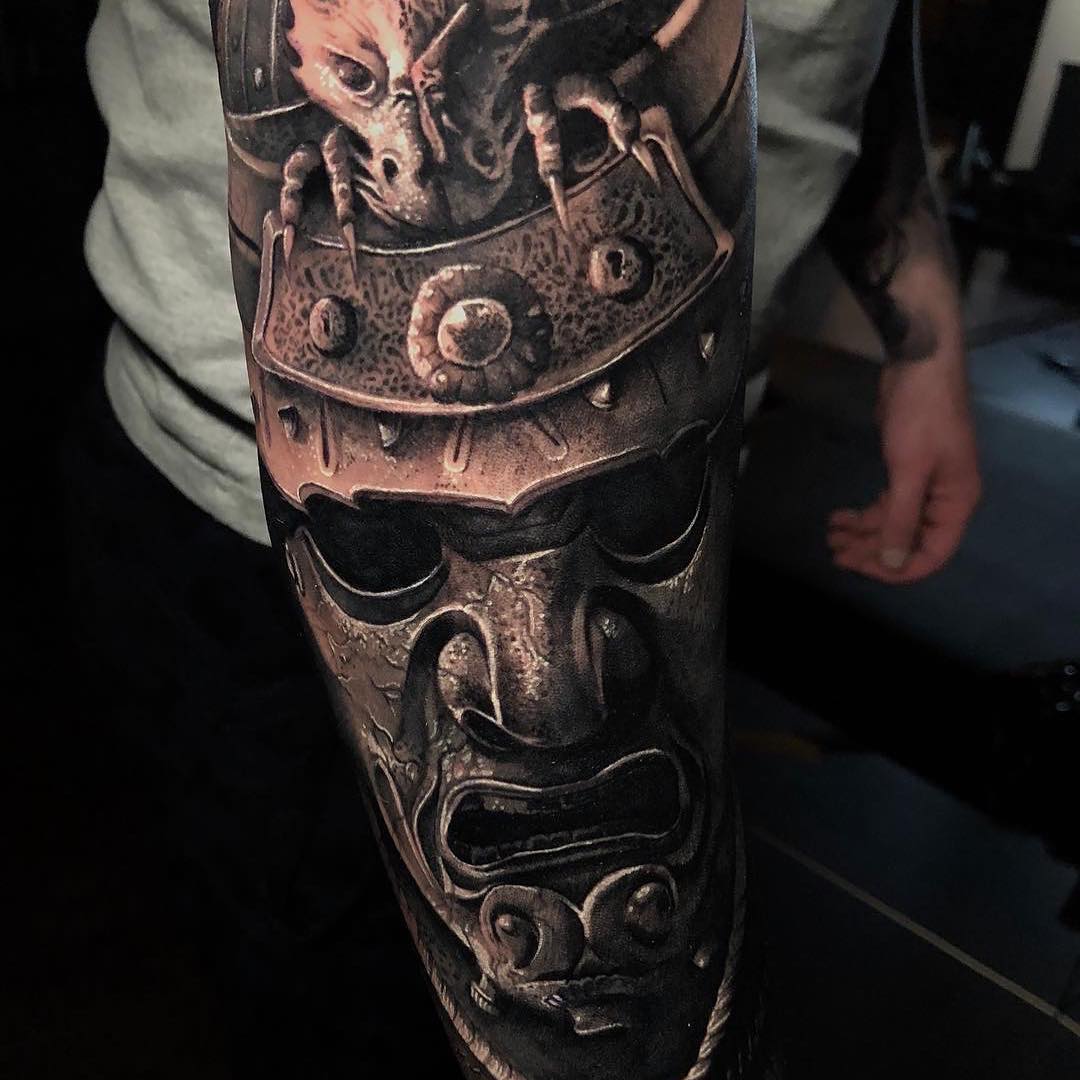Black & Grey Realism Tattoo of a Samurai Mask by Dom Brown