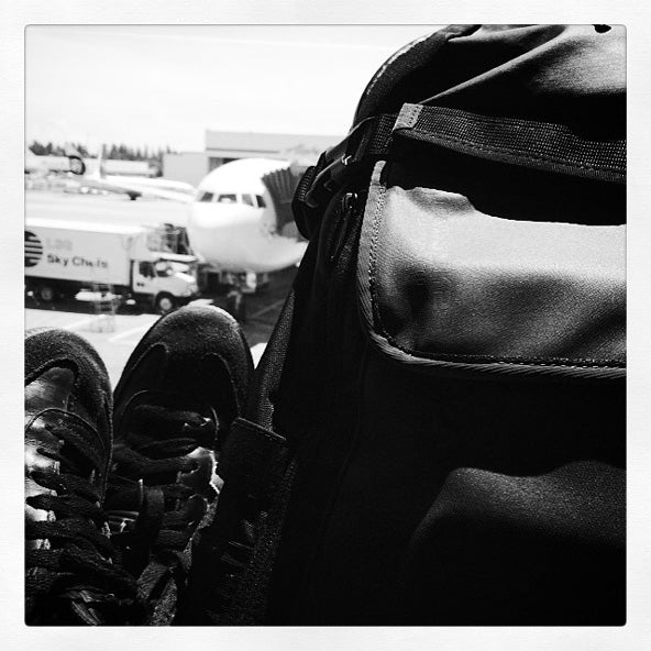 sambas and backpack at airport