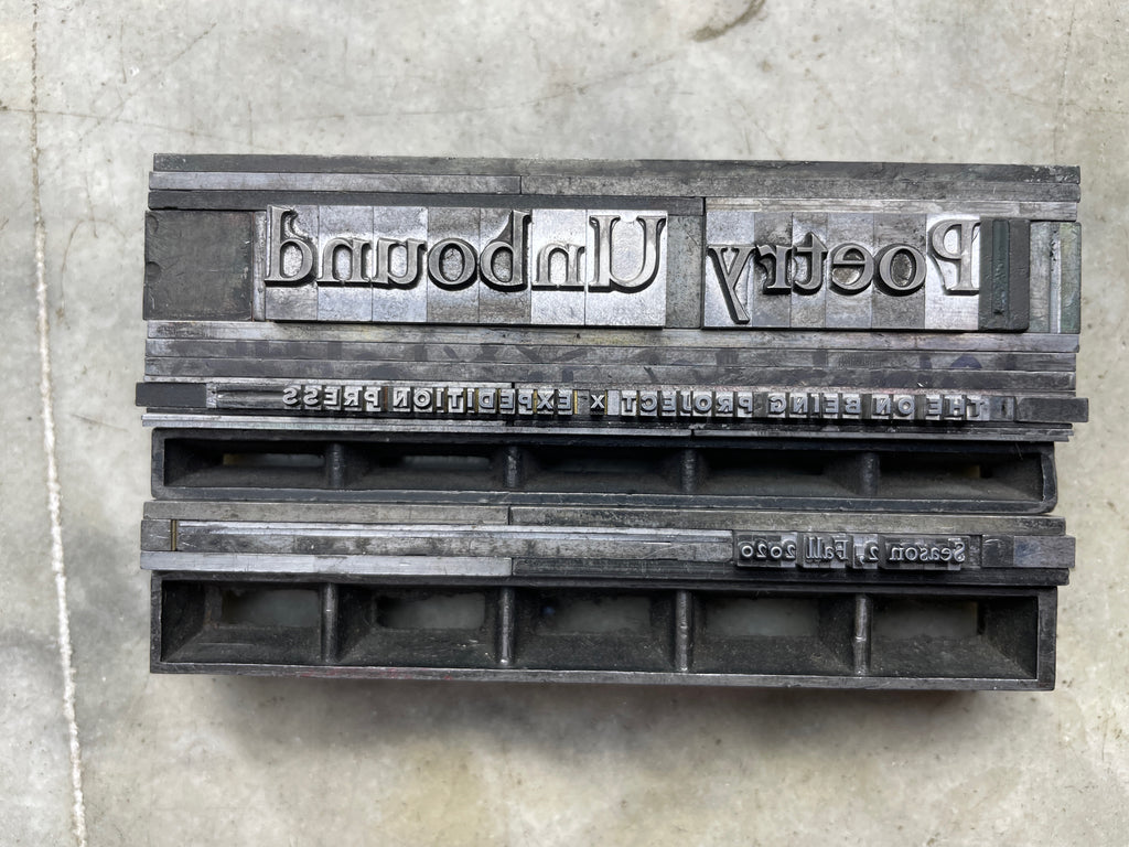 metal type form on stone, says Poetry Unbound