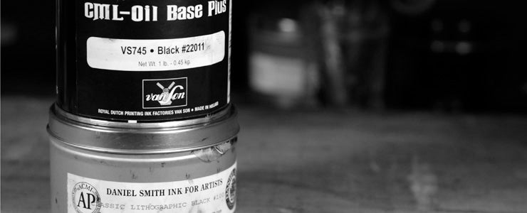 close up of two cans of letterpress ink