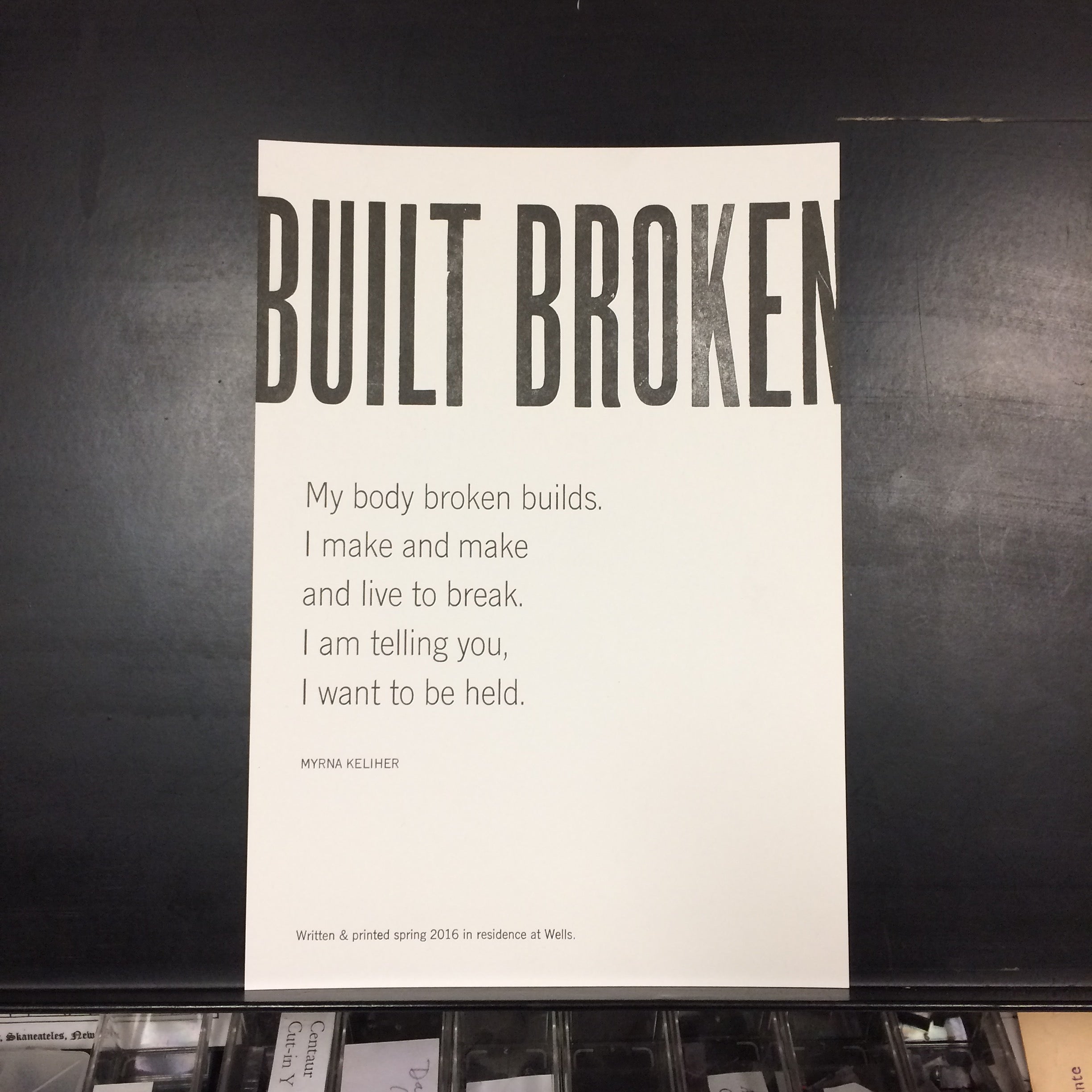 black and white letterpress broadside of poem "Built Broken"