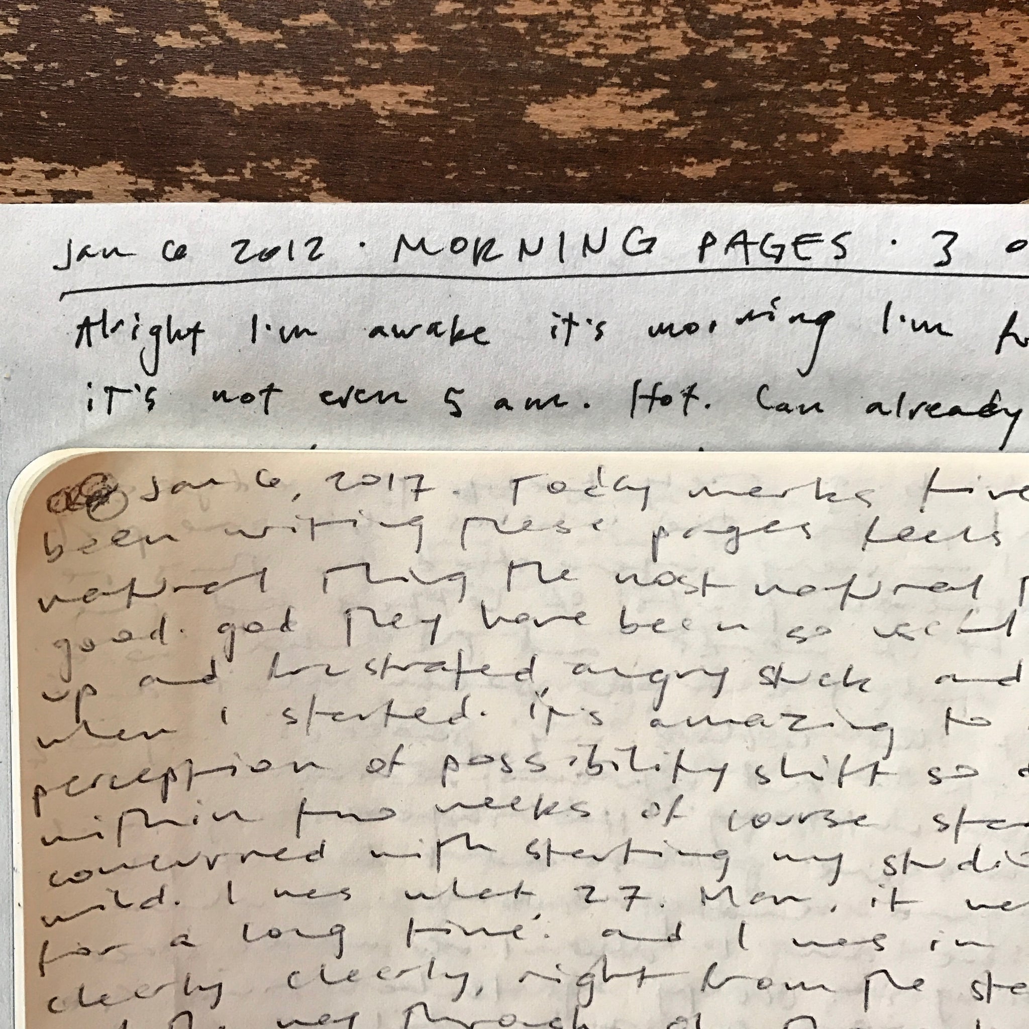 two pages of handwritten text overlaid