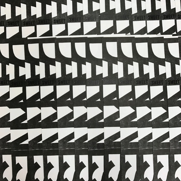 black and white patterned detail of overlapping prints