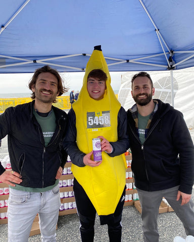 Posing with Rhode Racer dressed as a banana holding a can of Shimmer Seltzer Chai Cherry