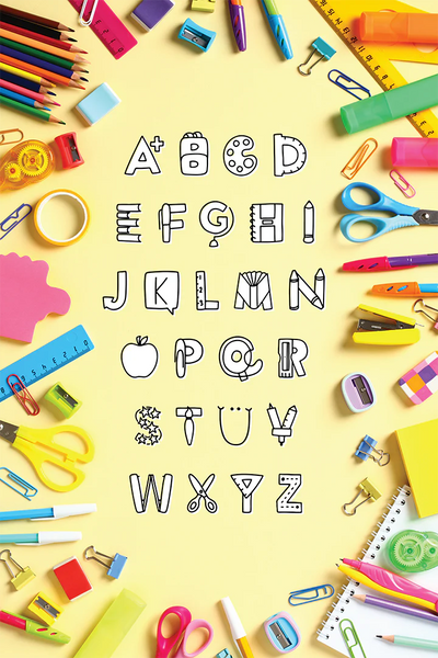 An image of the rad class font character set, on a yellow background with colored pencils and other teaching supplies surrounding it