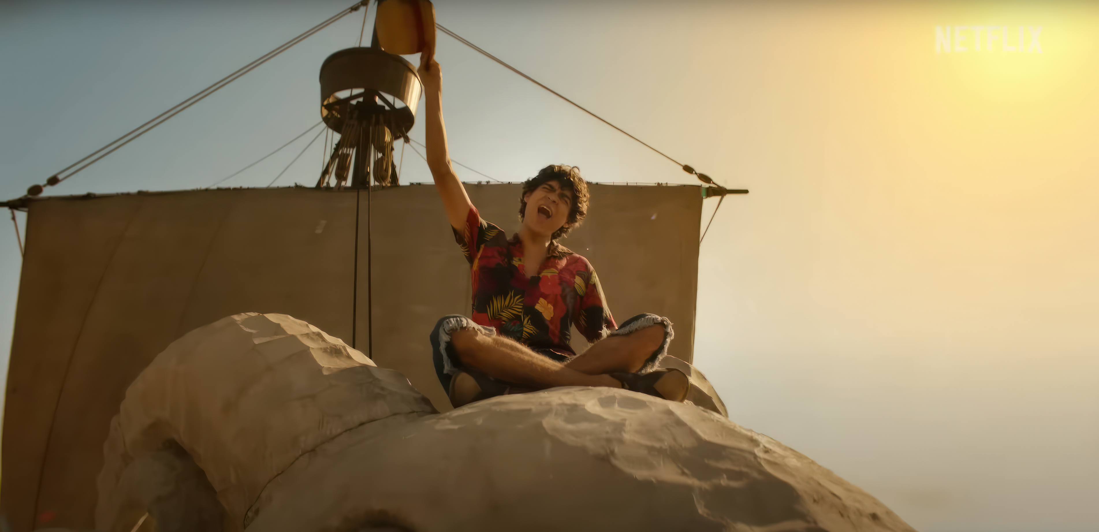 One Piece Netflix Live Action Luffy sitting on the Going Merry