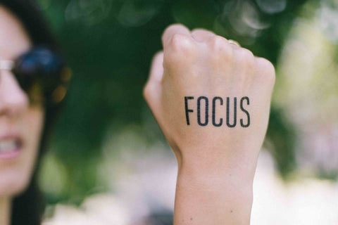 Fist with the word 'Focus' written on it. 