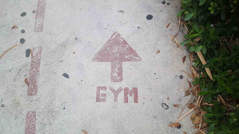 Arrow on sidewalk pointing to the gym