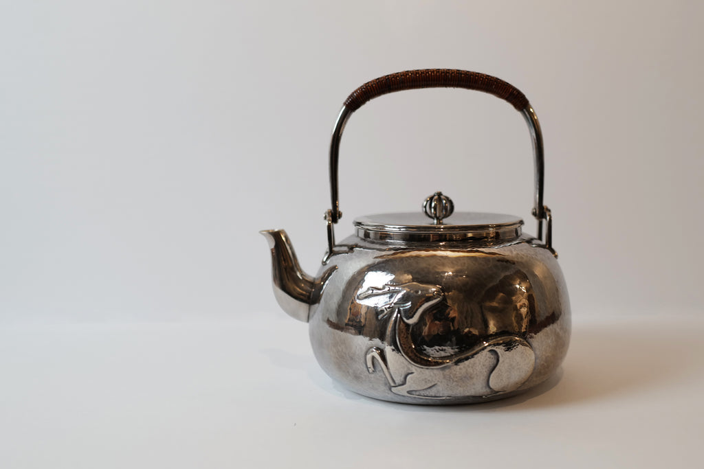 Silver Tea Kettle with Plum, Orchid, Bamboo, and Chrysanthemum 