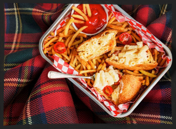 Macaroni Pie in a dish with fries on a Scottish Tartan blanket