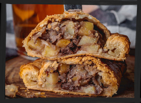 cut open steak pasty served on a board ready to eat