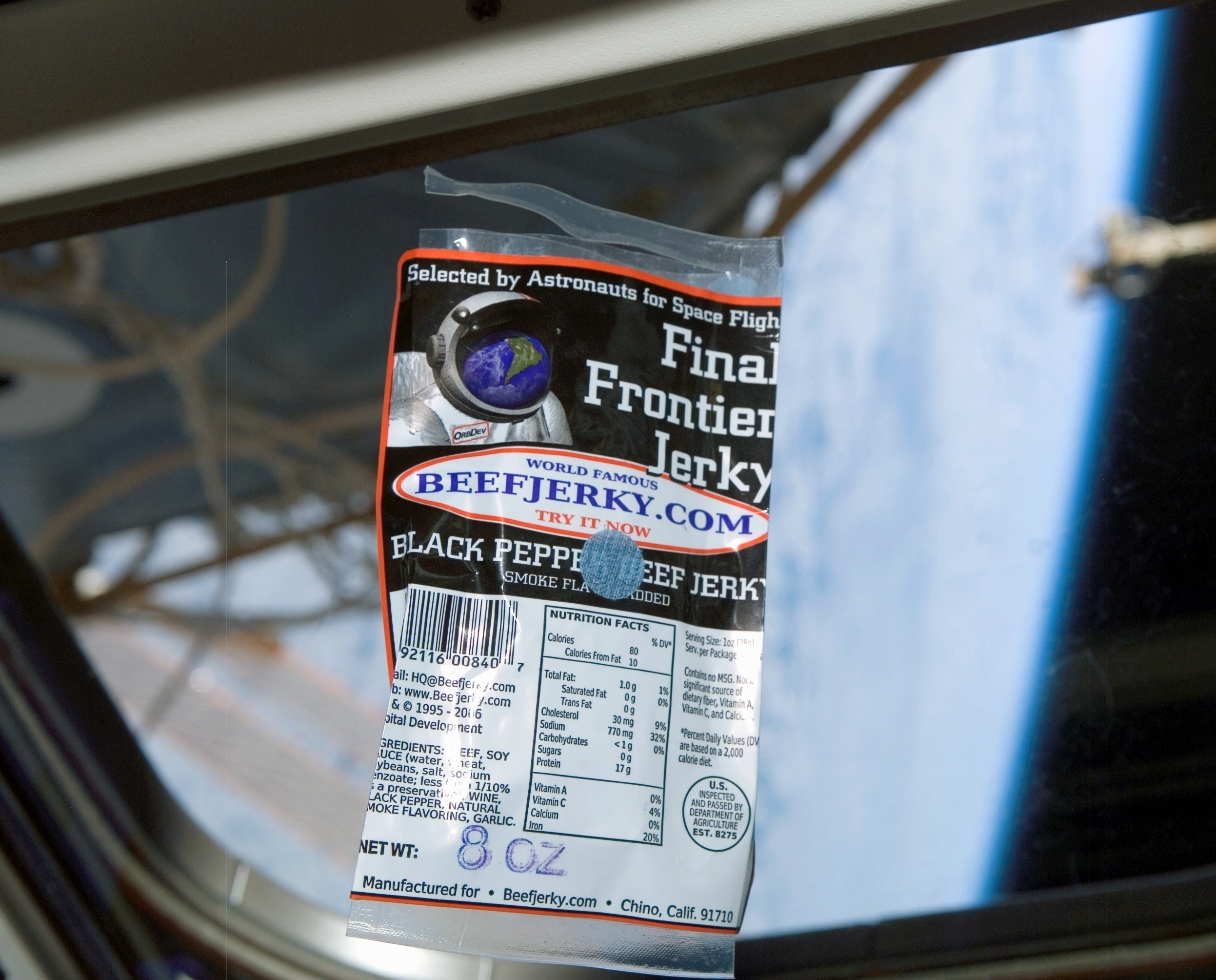 Beef Jerky on International Space Station with Earth visible out the big window. Carried to ISS aboard STS-118, Endevour Space Shuttle flight.