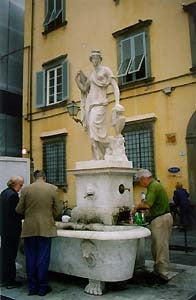 Statue of a Woman at a fountain in Lucca inspired the oil painting of Kelly Borsheim