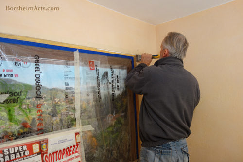 Wall Worker Antonio of Vellano added cement back into the wall to help with the faux window Mural