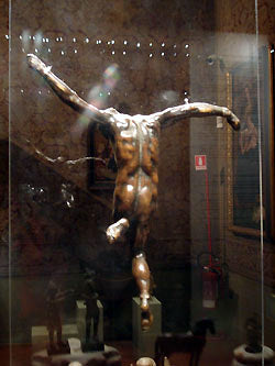 back view of bronze crucifix mounted on clear plastic for total display Bardini Museum Florence Italy