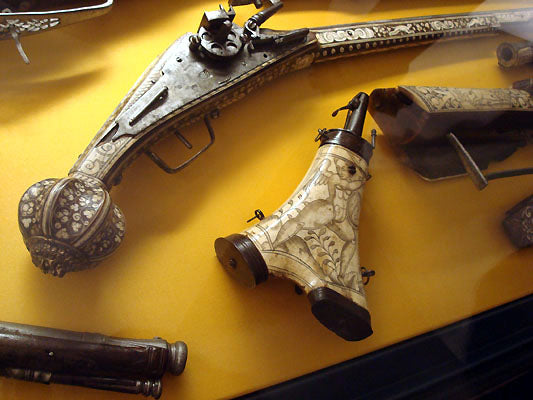 carved gun handle in weapons room exhibit Bardini Museum Florence Italy