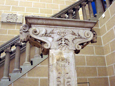 winged cherub standing on scroll design architectural decoration Stefano Bardini Museum in Florence, Italy