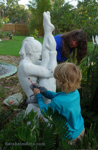 In Sanford, Florida, my nephew August helped me clean the Gymnast before adding more stone sealer to protect the marble.