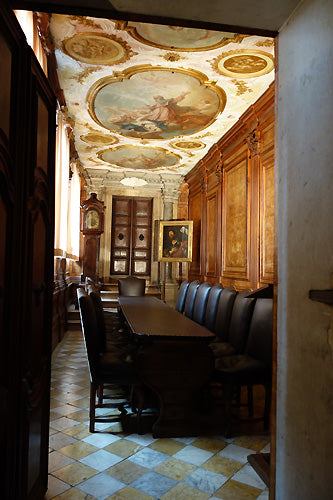 Gorgeous meeting room with Paintings on the Ceilings and Dark Wood walls tiled floors