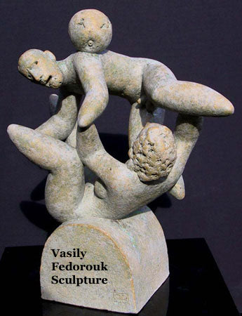 Unison ceramic sculpture of Adam and Eve with apple