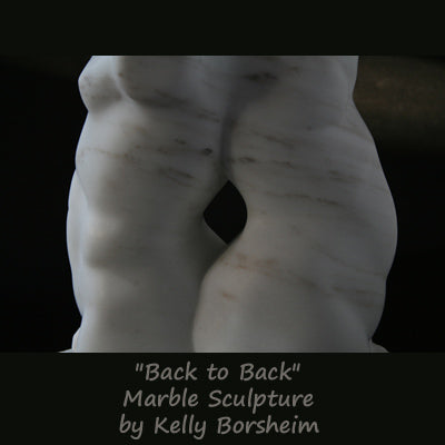 Back to Back marble sculpture of male and female torsos