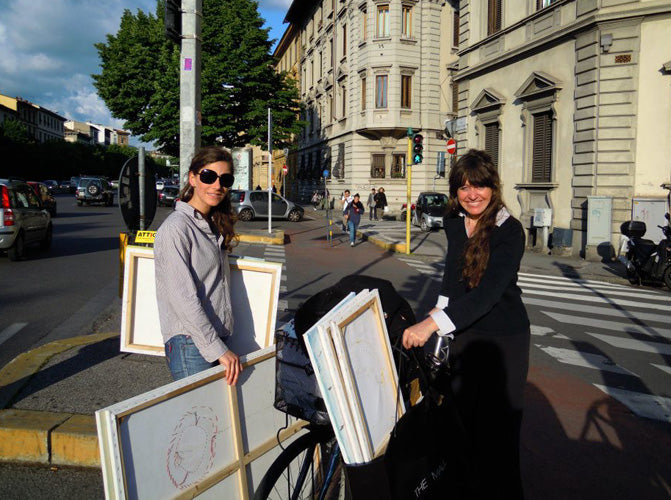 Below:  2012 May:  Dragana and Kelly moving Dragana's paintings across the Viale in Florence after the exhibit was over.