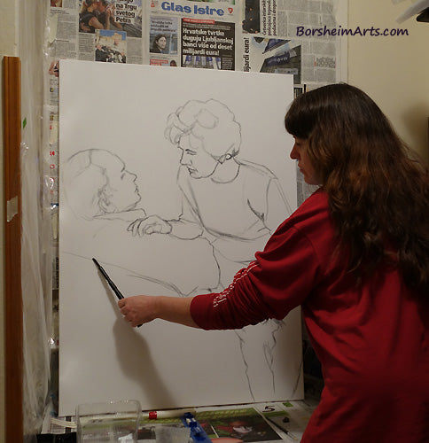 Kelly Borsheim uses the new Nitram baton to draw in charcoal the design of her new portrait painting.