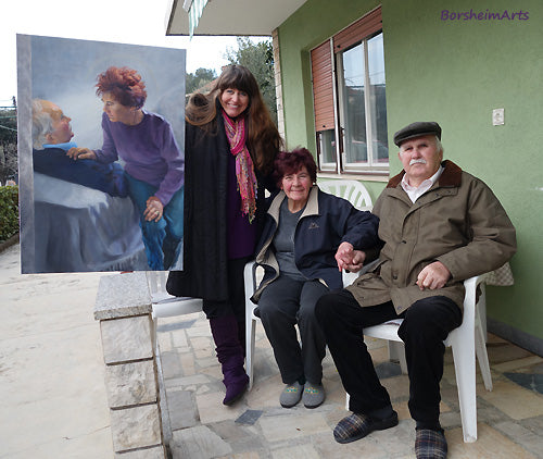 Umag, Croatia:  Artist Kelly Borsheim poses with her painting and her models in front of their home.  Spread love wherever you can.