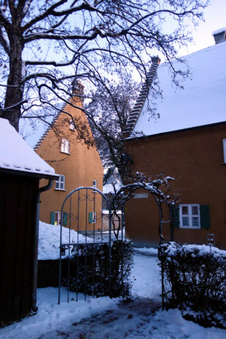 Each house has a small yard area to garden or work or live as one chooses in the Fuggerei. Many build small sheds to store firewood and such, Augsburg