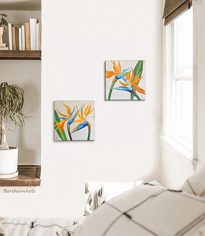 although a diptych set of paintings, the canvases brighten this boho bedroom scene of neutral colors hung diagonally with bright orange, blues, greens and a metallic silver background