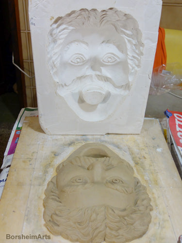 Plaster mold shows reverse image from the clay sculpture below it, art by Kelly Borsheim