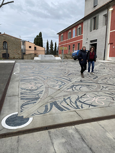 the mosaiced piazza in front of exhibition space in Vinci Italy